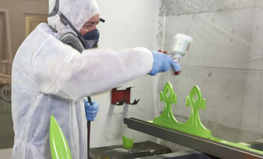 A paint technician spraying conservatory detail